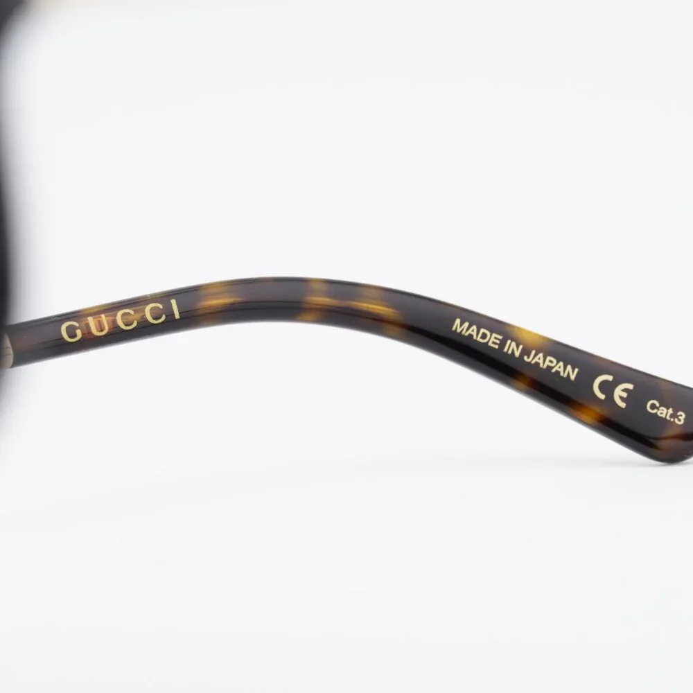 Gucci GG0199S 001 Sunglasses Shiny Black/Gold Shield Frame, Grey Lenses
